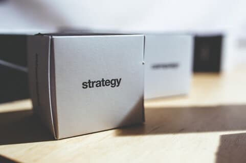 A close-up of a box with strategy words on it